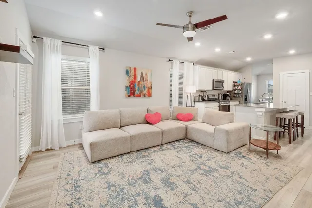 a living room with furniture and a large window