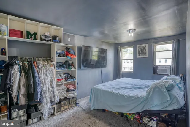 a bedroom with a bed and closet