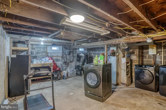 a aerial view of a house with a yard and potted plants