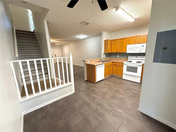 a kitchen with stainless steel appliances granite countertop a stove and a refrigerator