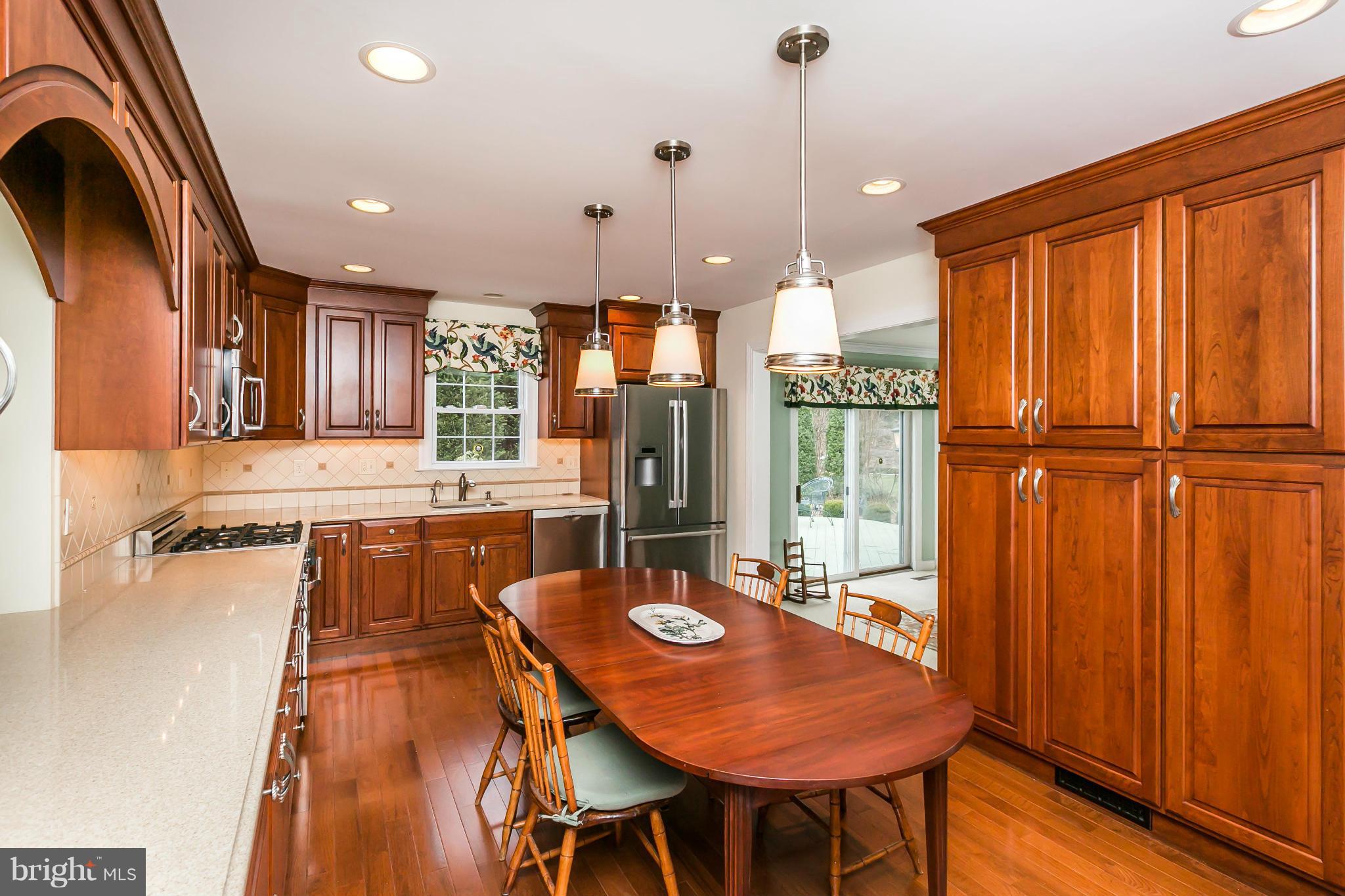 109 Charlesbrooke Road Baltimore, MD 21212 - Photo 11 of 30 a dinning table and chairs in a kitchen
