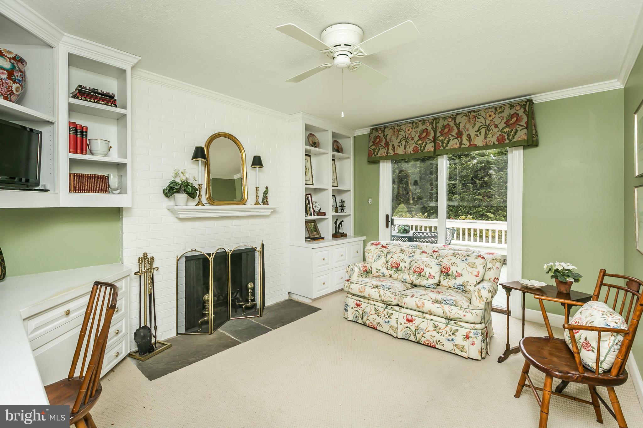 109 Charlesbrooke Road Baltimore, MD 21212 - Photo 16 of 30 a spacious bedroom with a bed a table chair and windows