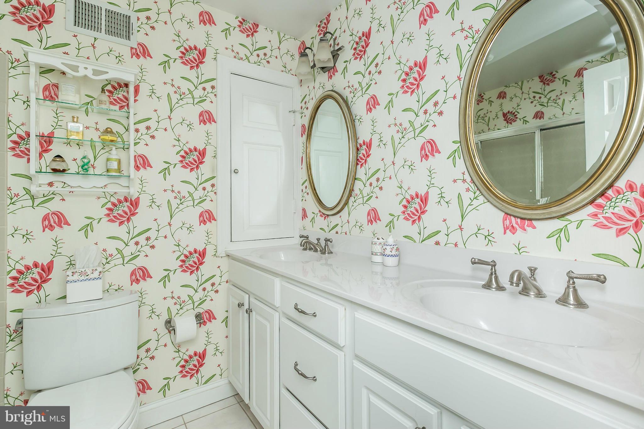 109 Charlesbrooke Road Baltimore, MD 21212 - Photo 19 of 30 a bathroom with a sink and a mirror with painted walls