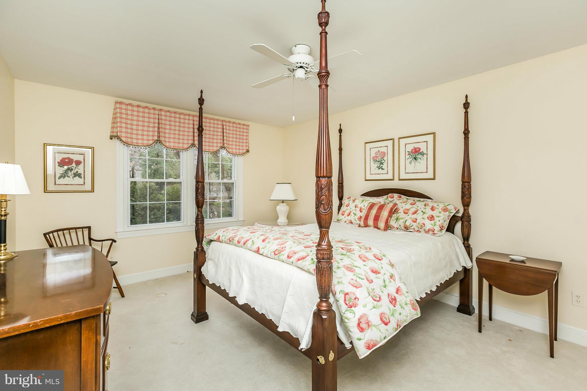 109 Charlesbrooke Road Baltimore, MD 21212 - Photo 21 of 30 a bedroom with a bed and a table