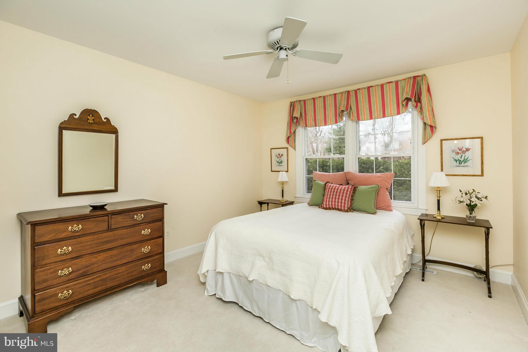 109 Charlesbrooke Road Baltimore, MD 21212 - Photo 22 of 30 a bedroom with a bed and a dresser
