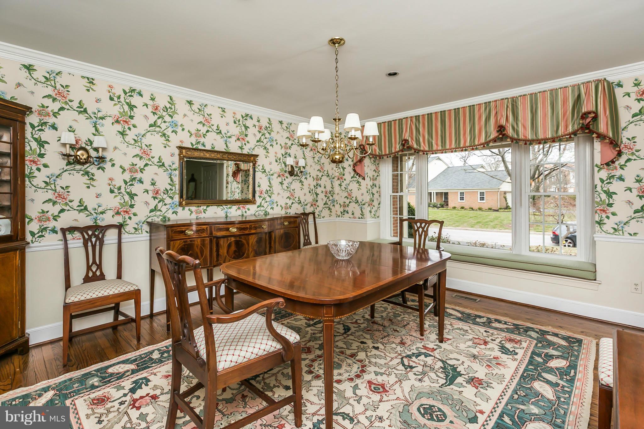 109 Charlesbrooke Road Baltimore, MD 21212 - Photo 8 of 30 a dining room with furniture a chandelier and wooden floor