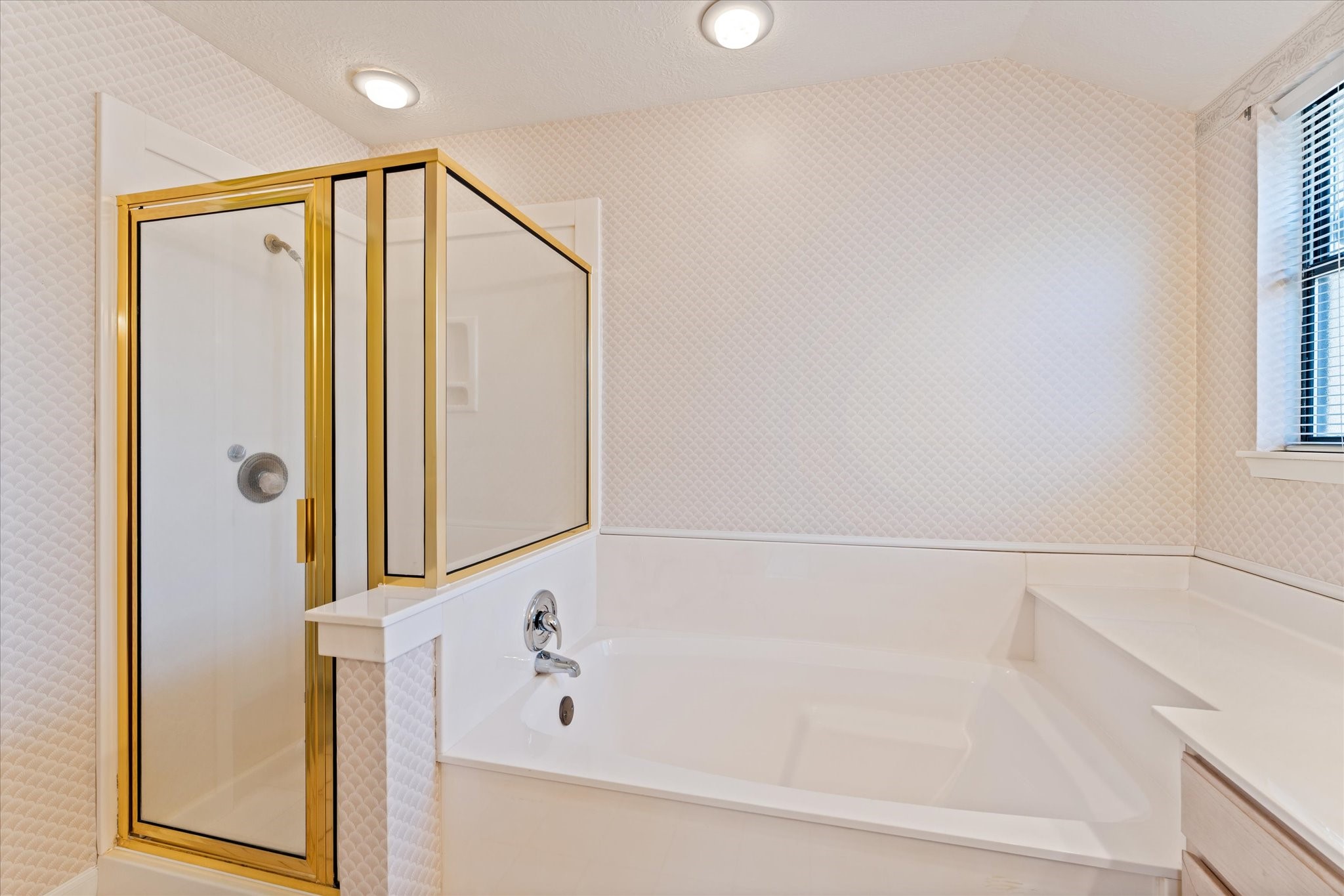 215 Deep Dale Lane Conroe, TX 77304 - Photo 22 of 34 Primary bathroom offers a separate shower and tub configuration.