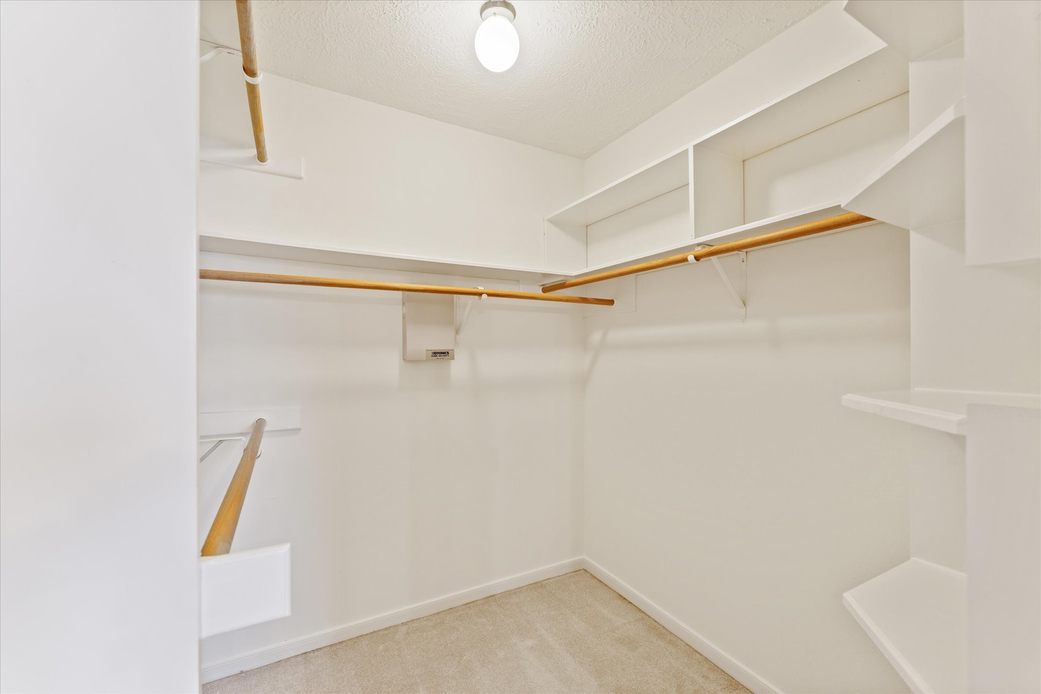 215 Deep Dale Lane Conroe, TX 77304 - Photo 23 of 34 This Walk-in closet is found adjacent to the primary bathroom.