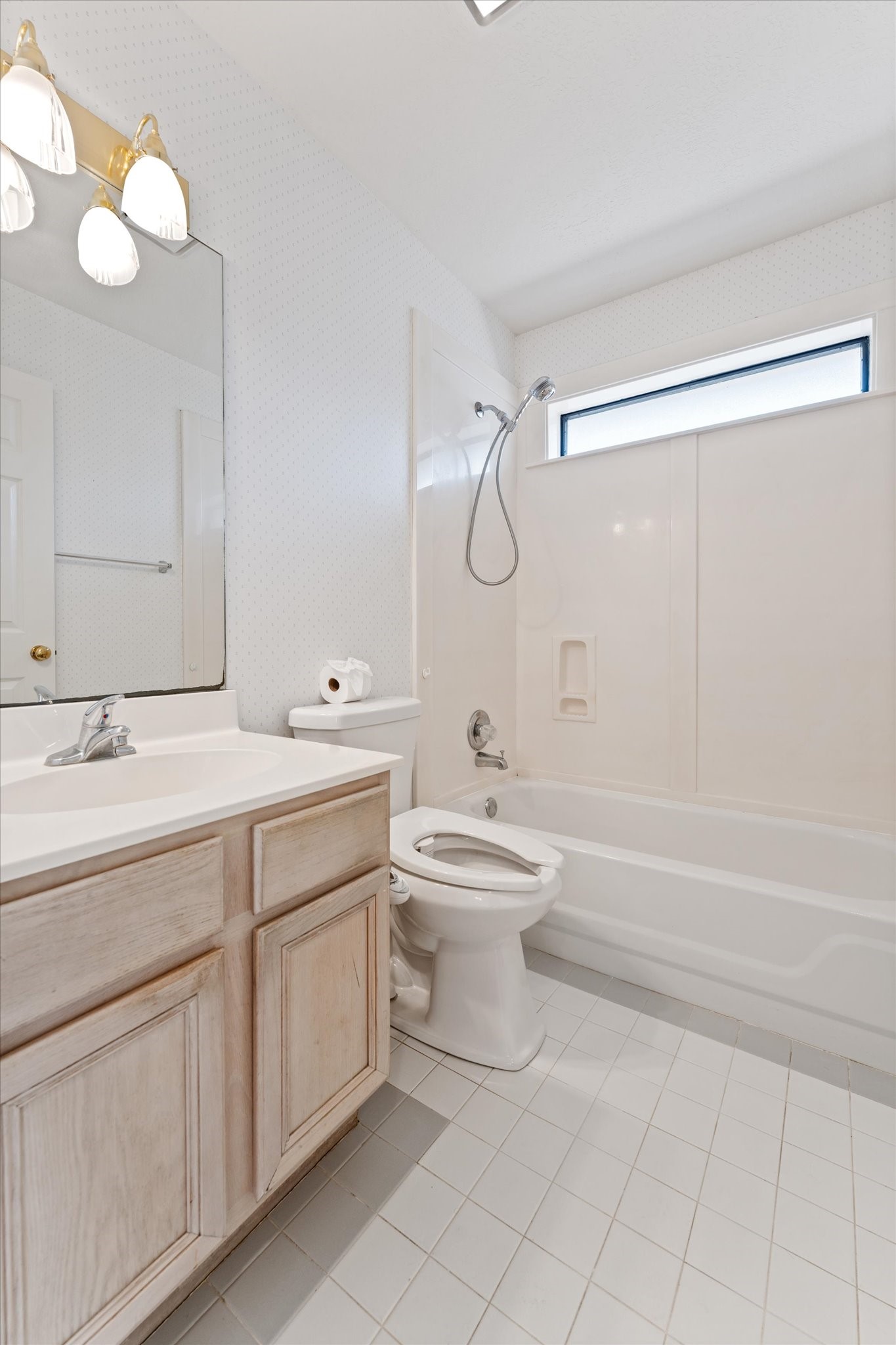 215 Deep Dale Lane Conroe, TX 77304 - Photo 25 of 34 Guest bathroom is located between the first & second bedroom.