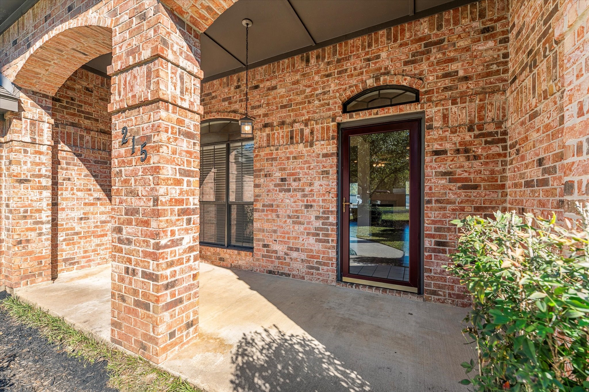 215 Deep Dale Lane Conroe, TX 77304 - Photo 3 of 34 Beautiful front porch is a welcoming entrance.