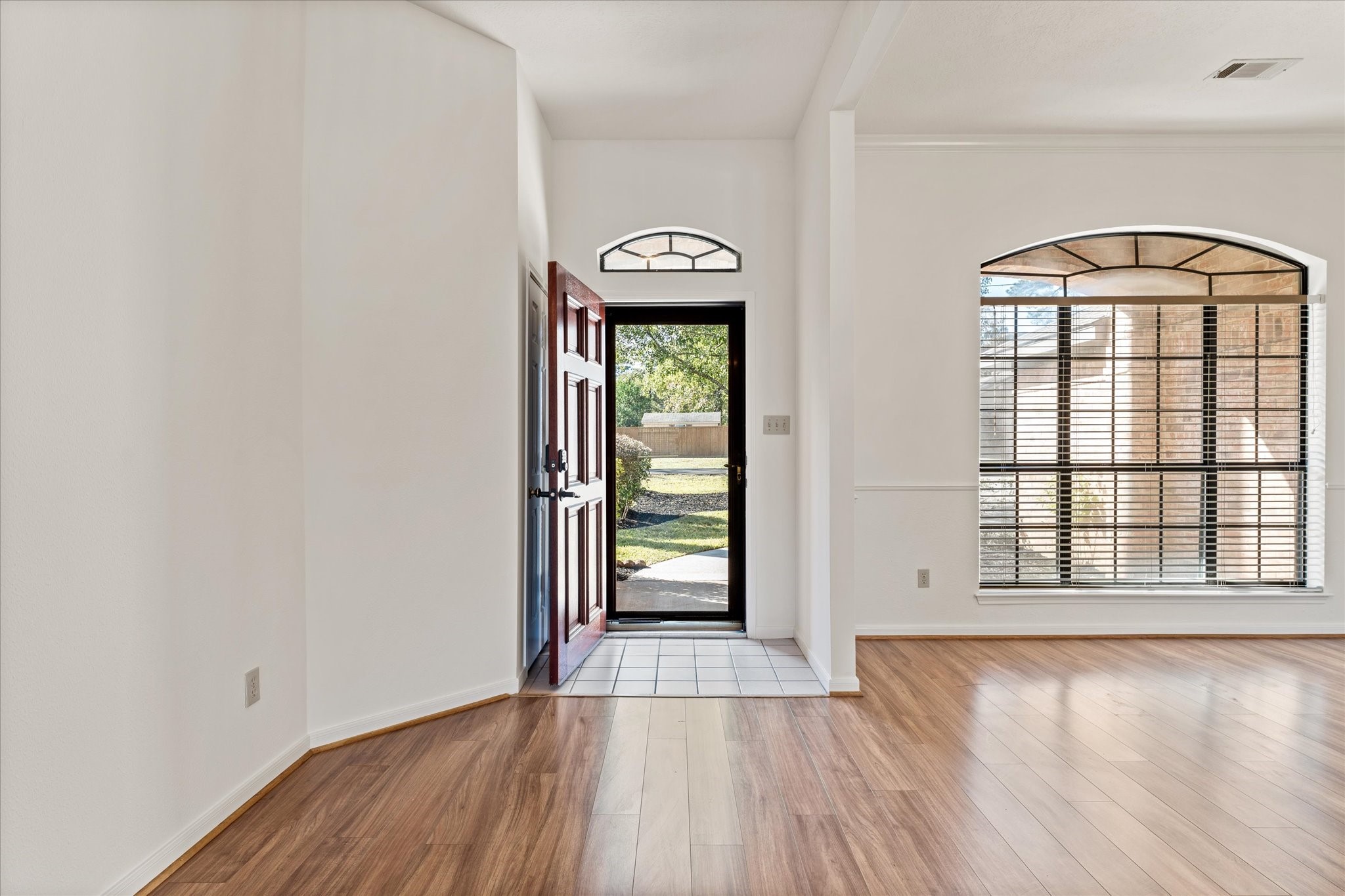 215 Deep Dale Lane Conroe, TX 77304 - Photo 6 of 34 Front entrance opens up to the living and dining spaces.