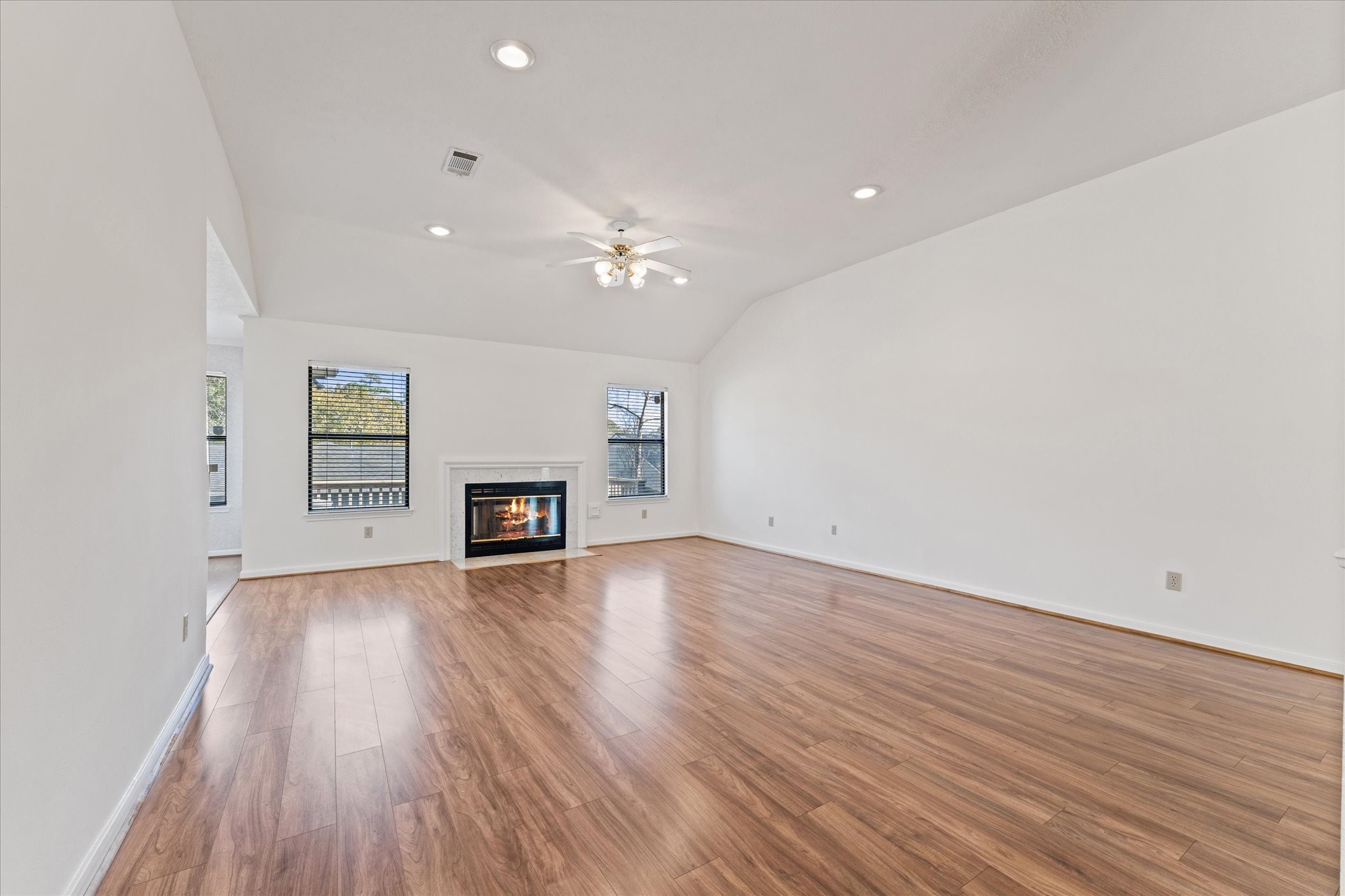 215 Deep Dale Lane Conroe, TX 77304 - Photo 10 of 34 Gas-log fireplace is a nice bonus here.