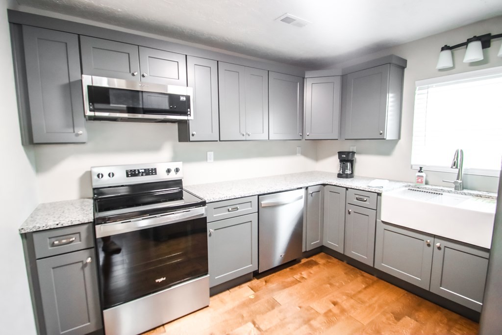 244 West Bockman Way Sparta, TN 38583 - Photo 15 of 23 a kitchen with a sink stove and microwave