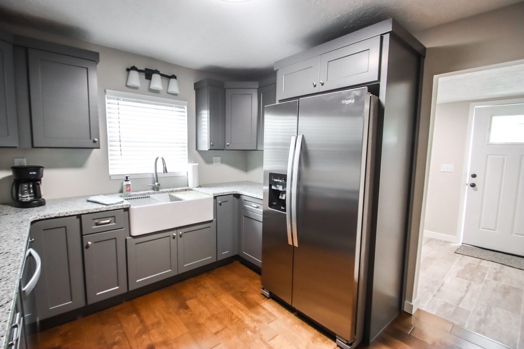 244 West Bockman Way Sparta, TN 38583 - Photo 16 of 23 a kitchen with a refrigerator sink and cabinets