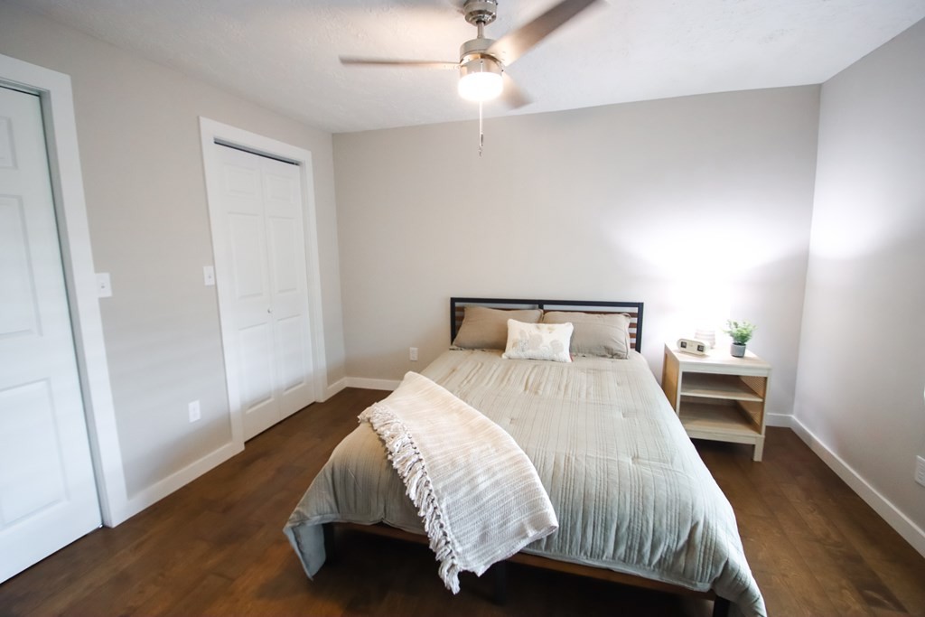244 West Bockman Way Sparta, TN 38583 - Photo 18 of 23 a bedroom with a bed and wooden floor