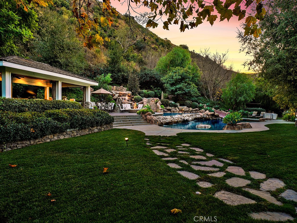 28291 Williams Canyon Road Silverado, CA 92676 - Photo 64 of 74 a view of a house with backyard sitting area and garden