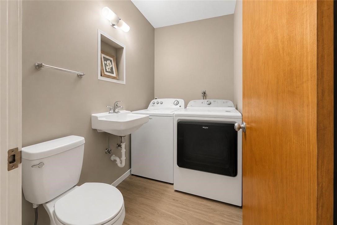 9675 County Road 325 Mathis, TX 78368 - Photo 26 of 29 a white toilet sitting next to a bathroom sink