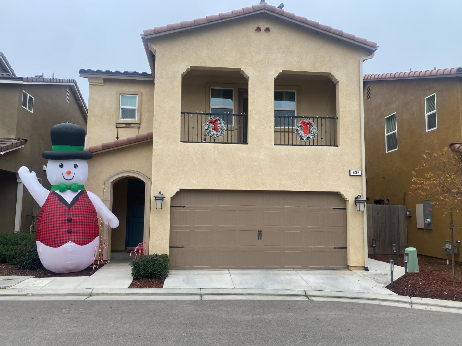 a front view of a house with garage