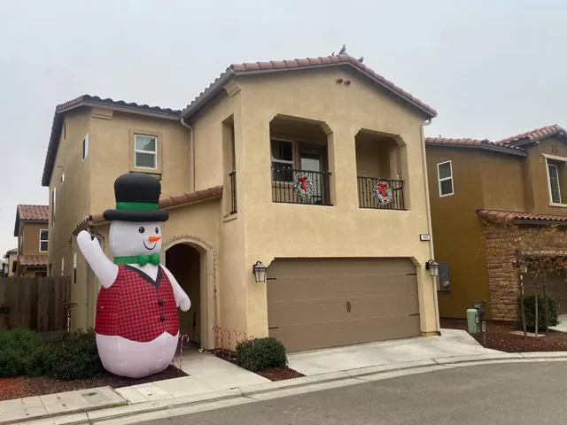 a front view of a house with garage