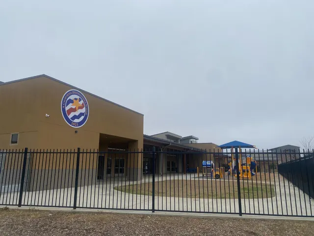 a view of a park that has a sign board