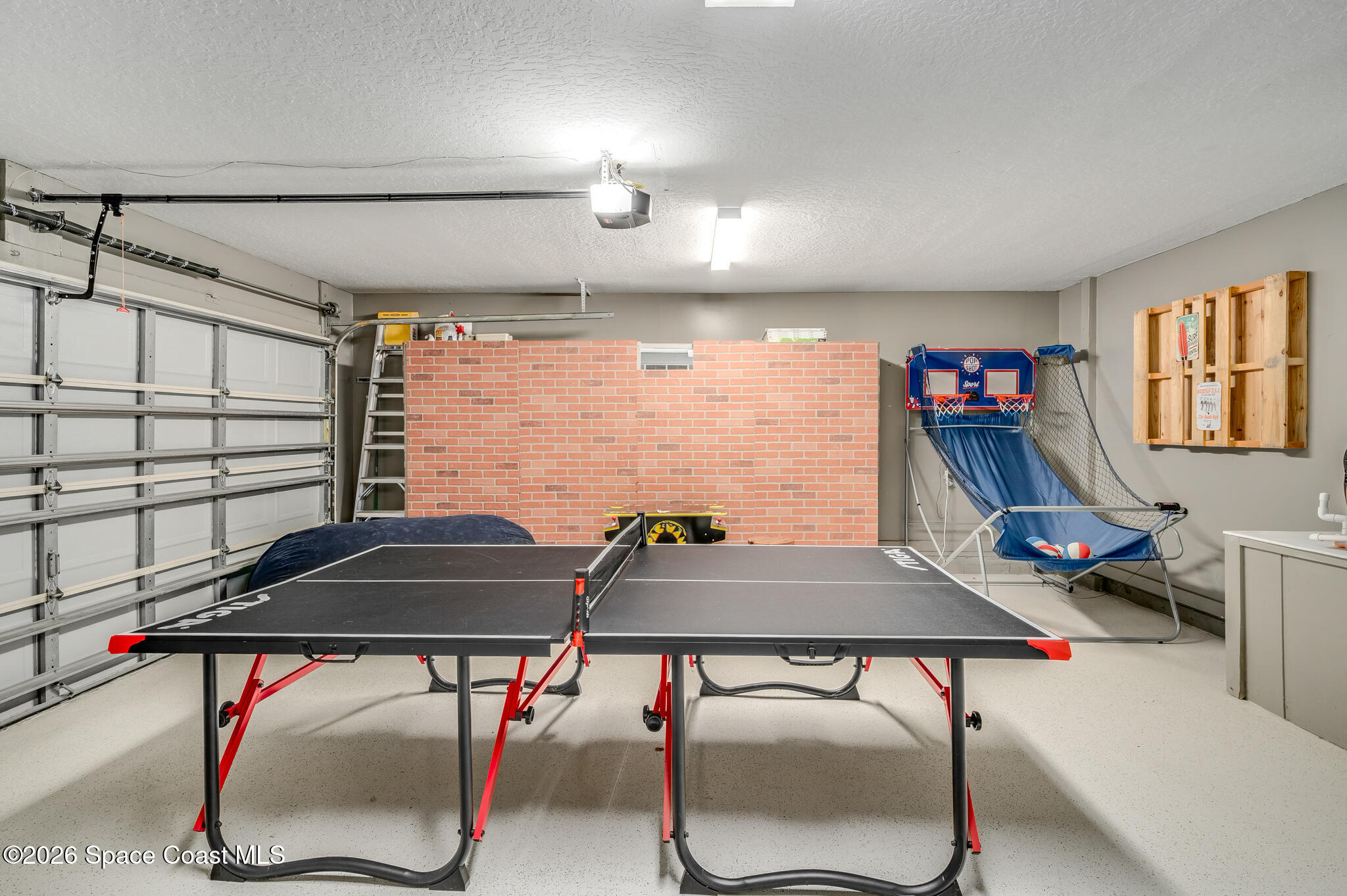 999 Sunswept Road Northeast Palm Bay, FL 32905 - Photo 55 of 85 Play room - Garage