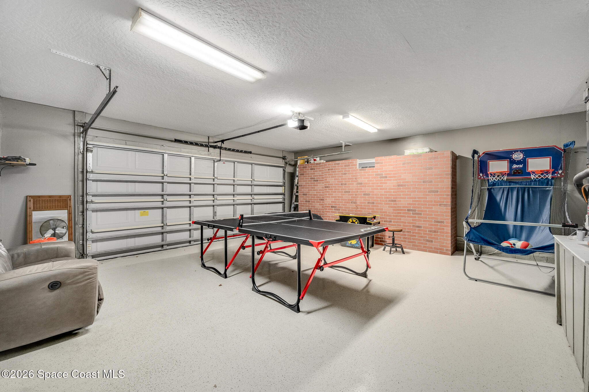999 Sunswept Road Northeast Palm Bay, FL 32905 - Photo 58 of 85 Play Room - Garage