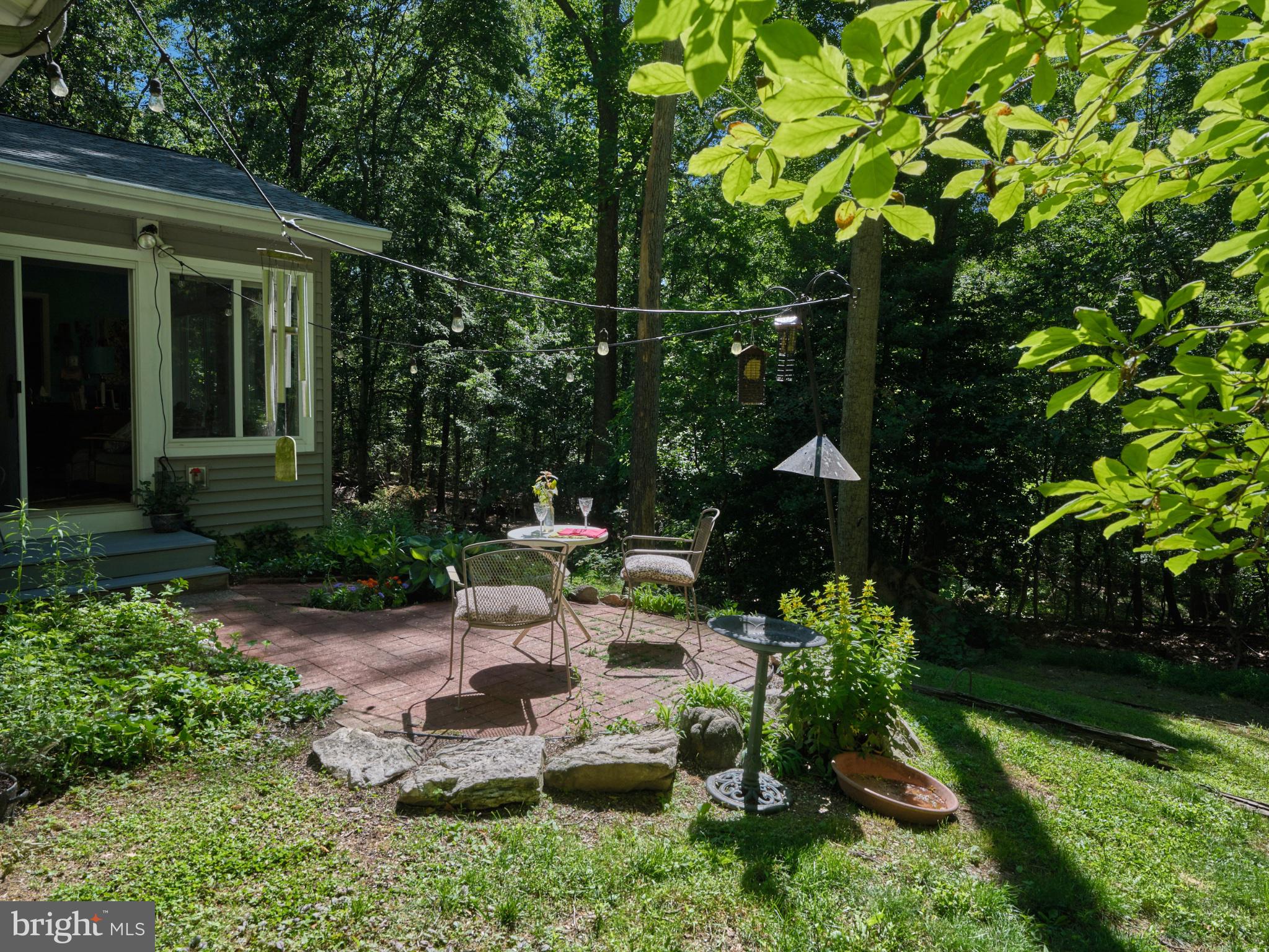 4831 Mountain Top Road West, Unit W New Hope, PA 18938 - Photo 22 of 28 Serene patio nestled in lush greenery.