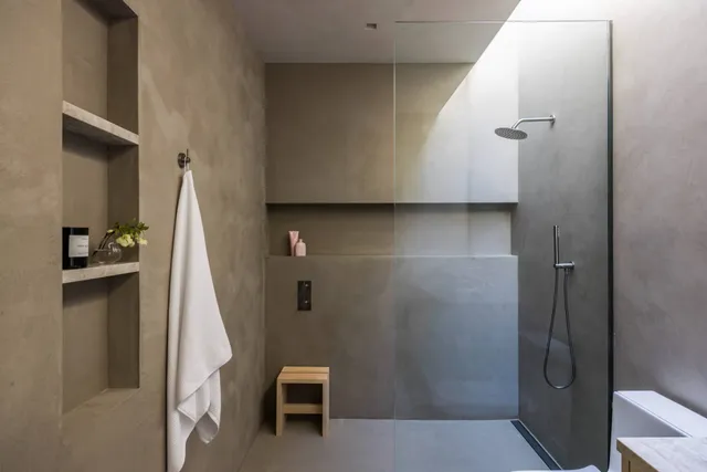 a bedroom with a bed and a wall painting