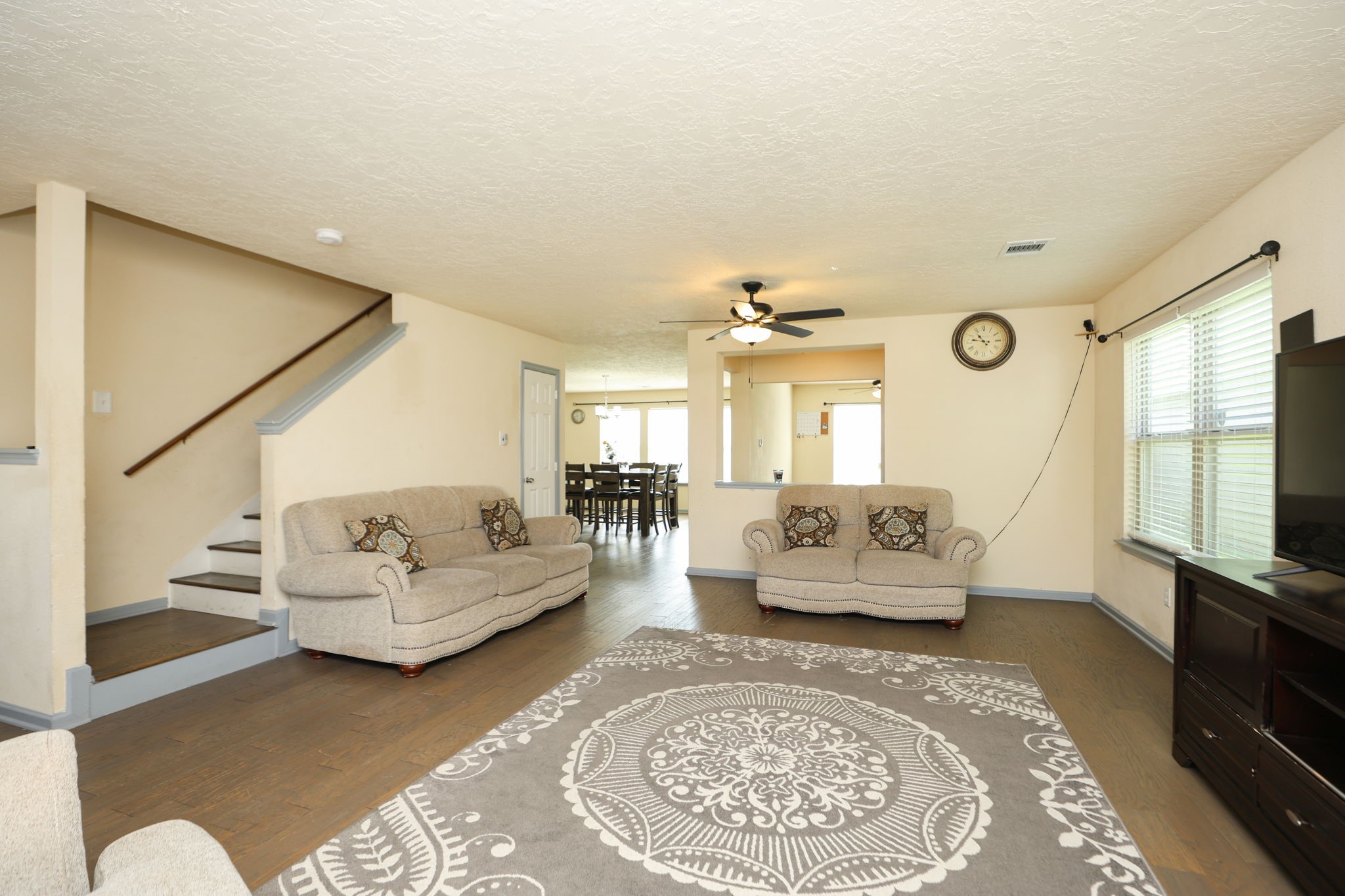 11642 Quinn Ridge Way Houston, TX 77038 - Photo 4 of 22 Another view of the family room where you can see the stairs near the entry.