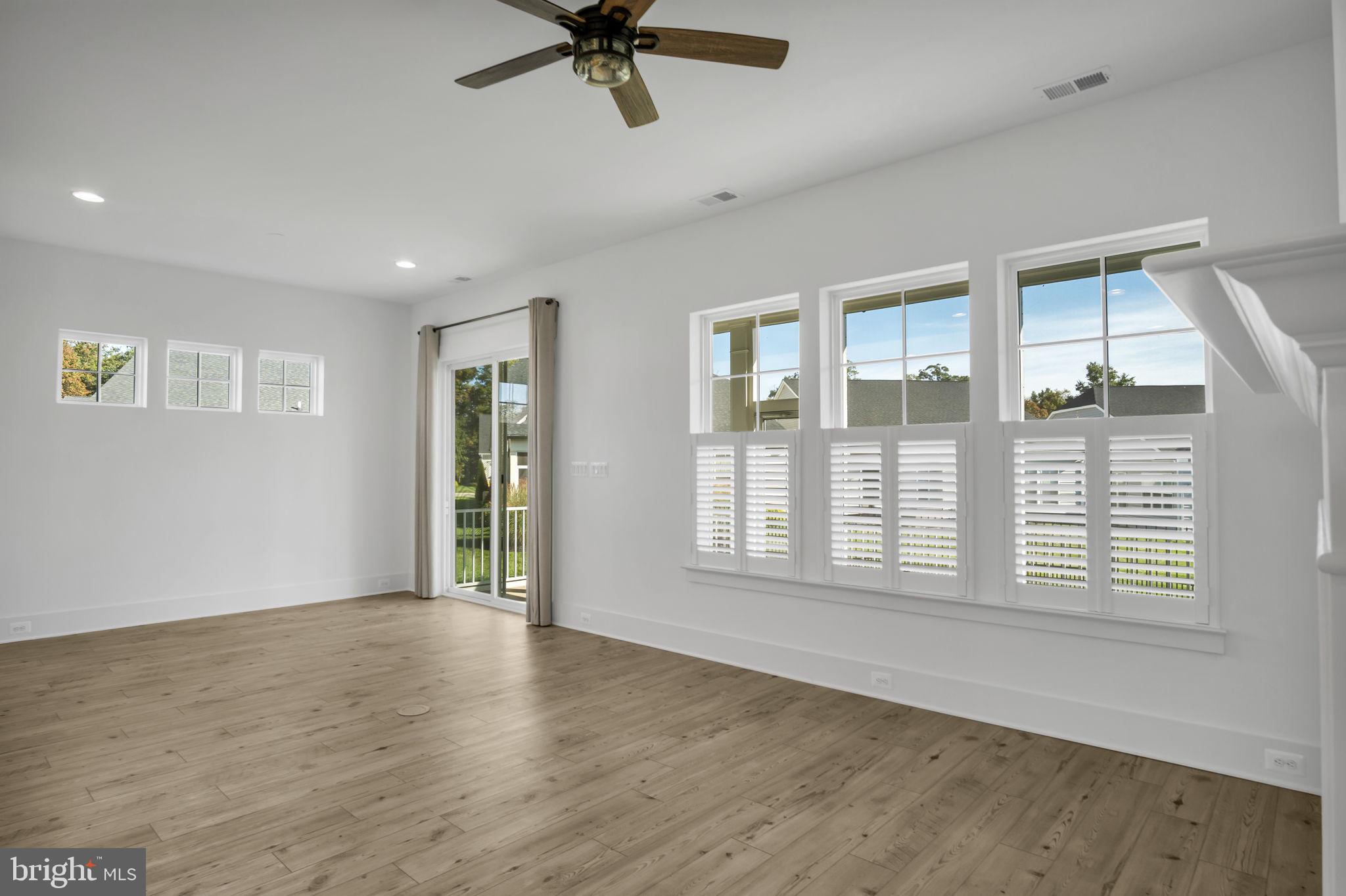 23 Highland View Lane Gettysburg, PA 17325 - Photo 12 of 87 a view of an empty room with a window and wooden floor