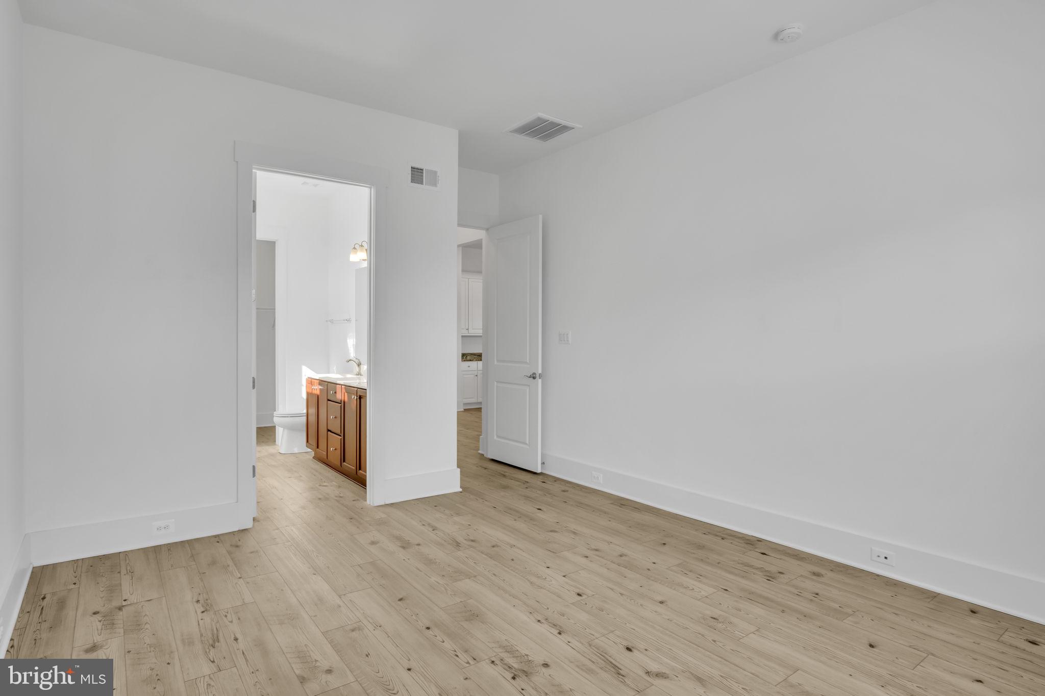23 Highland View Lane Gettysburg, PA 17325 - Photo 25 of 87 a view of a hallway with wooden floor and a bathroom