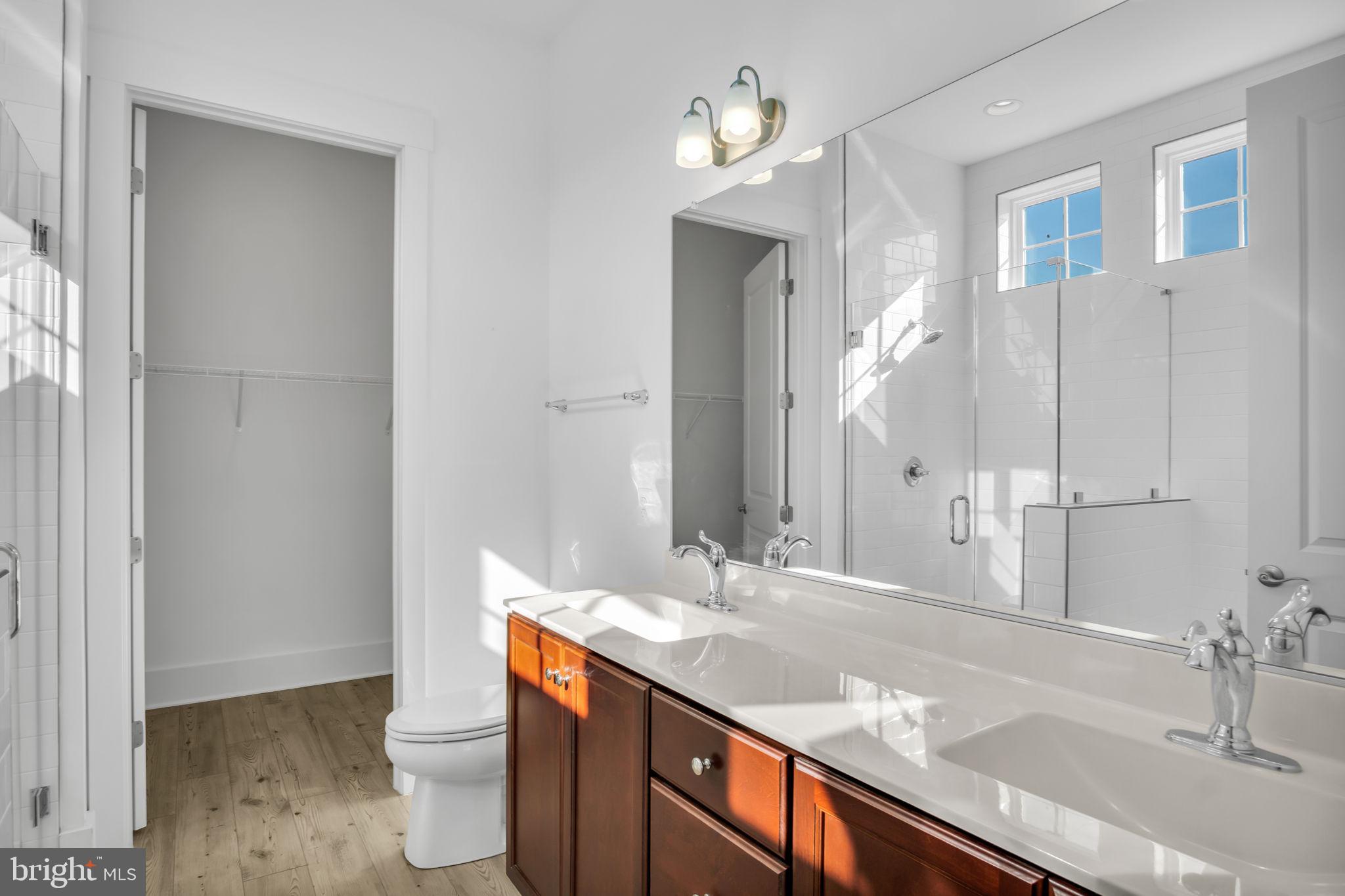 23 Highland View Lane Gettysburg, PA 17325 - Photo 26 of 87 a bathroom with a granite countertop sink a toilet a mirror and shower