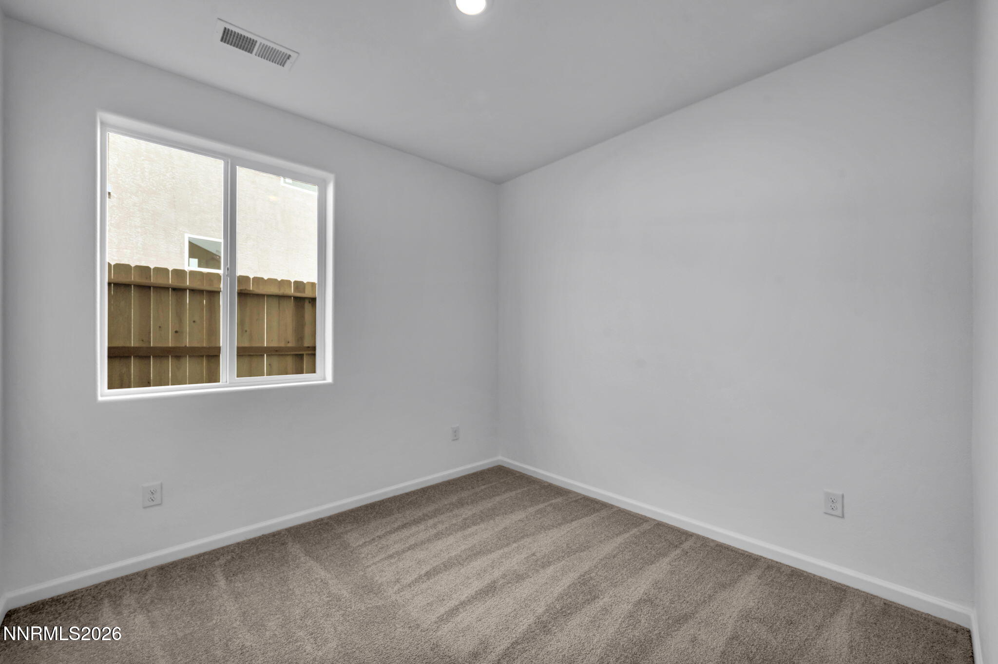 6676 Morgan Mill Road, Unit HOMESITE 14 Carson City, NV 89701 - Photo 12 of 24 a view of an empty room with a window