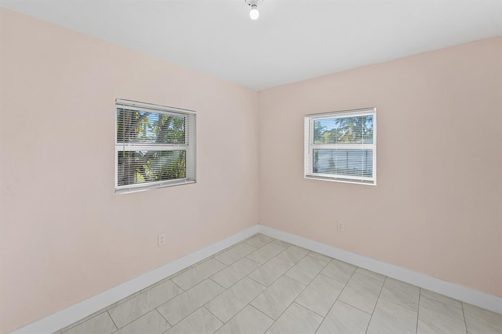 27100 Southwest 144th Avenue Homestead, FL 33032 - Photo 14 of 24 an empty room with windows