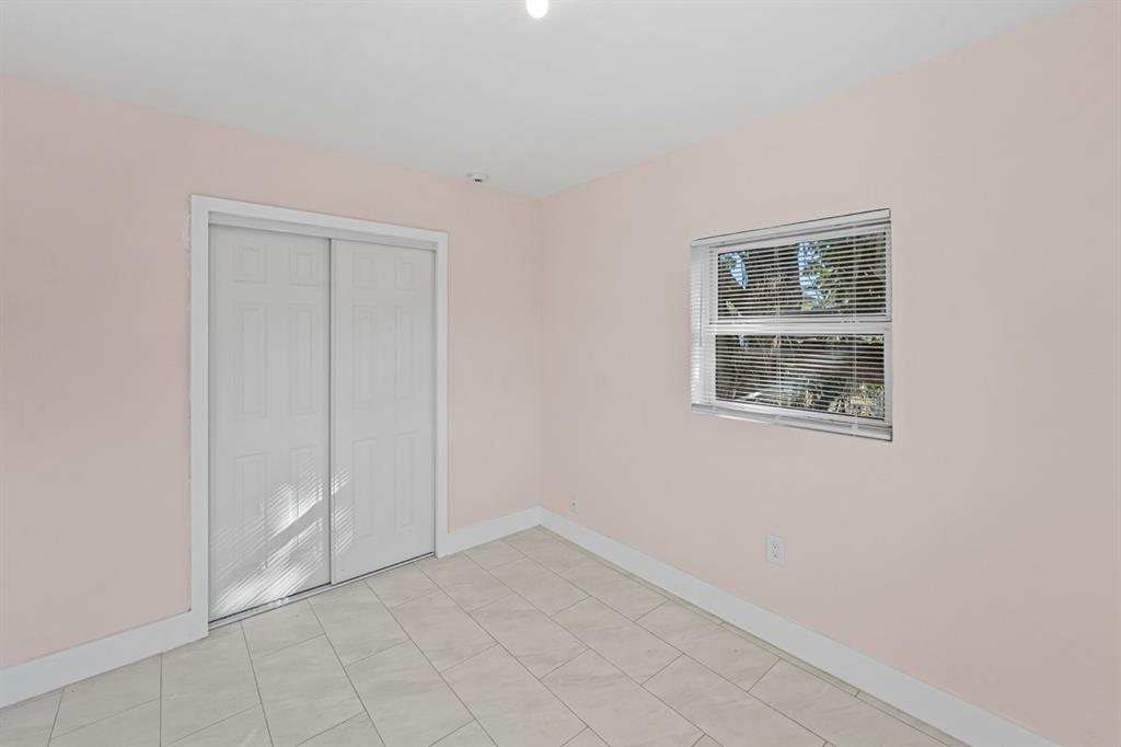 27100 Southwest 144th Avenue Homestead, FL 33032 - Photo 15 of 24 an empty room with windows