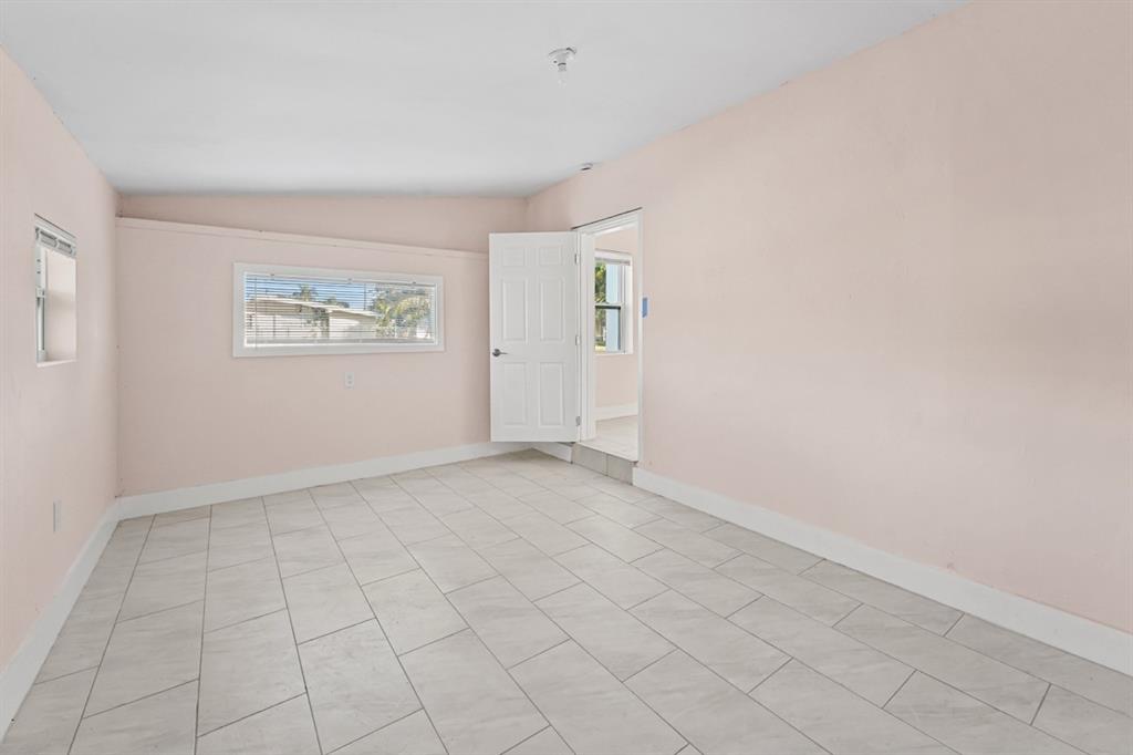 27100 Southwest 144th Avenue Homestead, FL 33032 - Photo 16 of 24 an empty room with windows