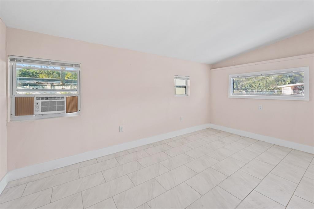 27100 Southwest 144th Avenue Homestead, FL 33032 - Photo 17 of 24 an empty room with a window