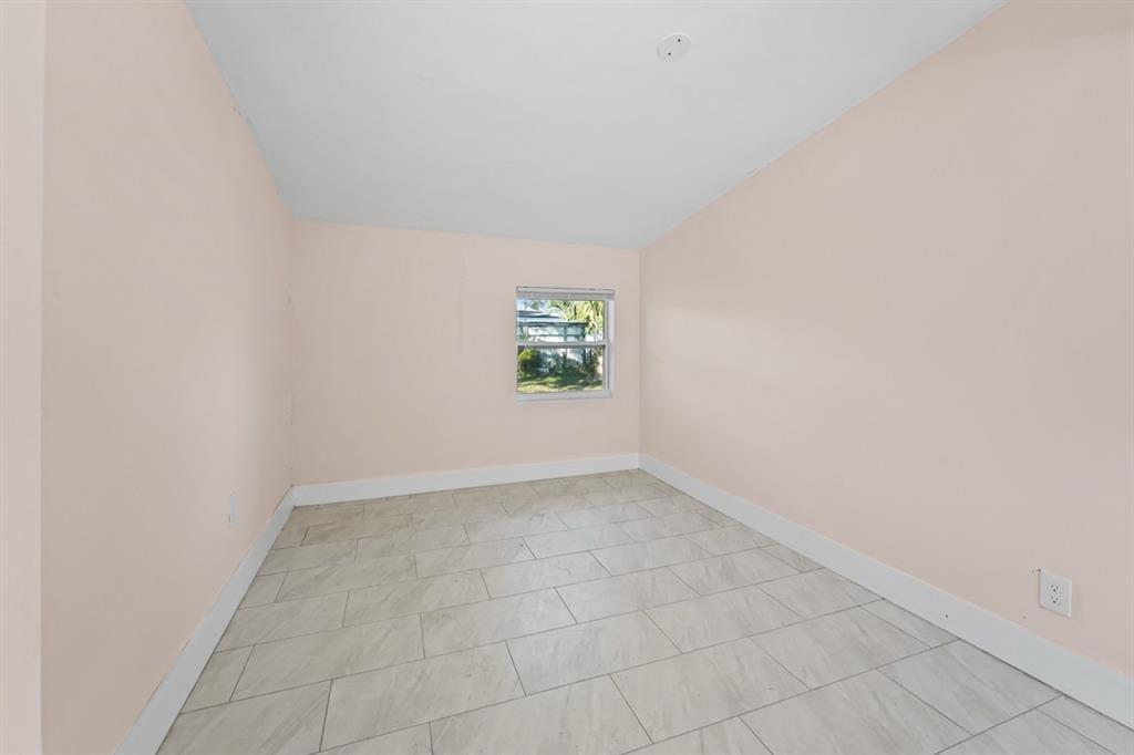 27100 Southwest 144th Avenue Homestead, FL 33032 - Photo 18 of 24 an empty room with windows
