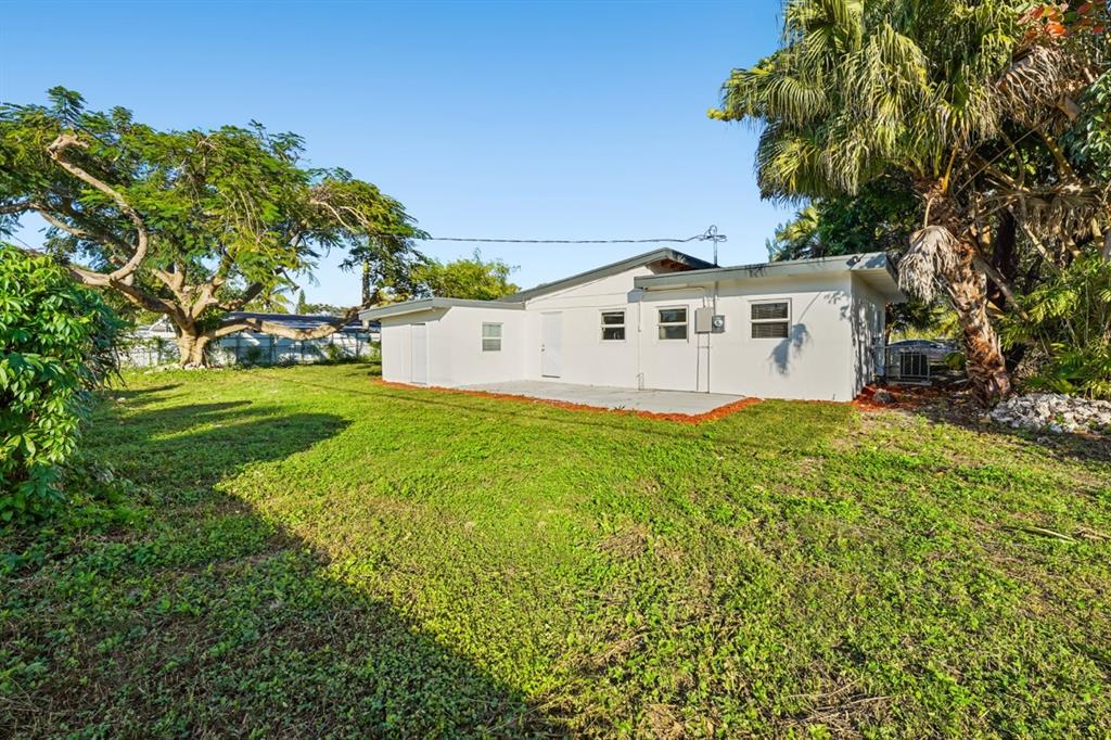 27100 Southwest 144th Avenue Homestead, FL 33032 - Photo 20 of 24 a view of a house with a yard