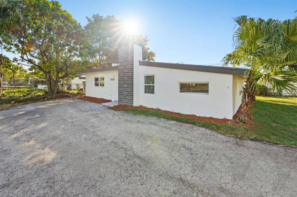 27100 Southwest 144th Avenue Homestead, FL 33032 - Photo 23 of 24 a view of a house with a backyard