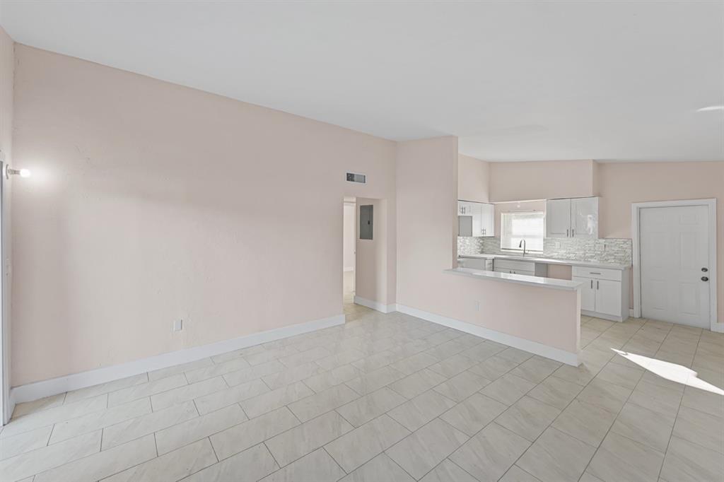 27100 Southwest 144th Avenue Homestead, FL 33032 - Photo 5 of 24 a view of a kitchen with white cabinets
