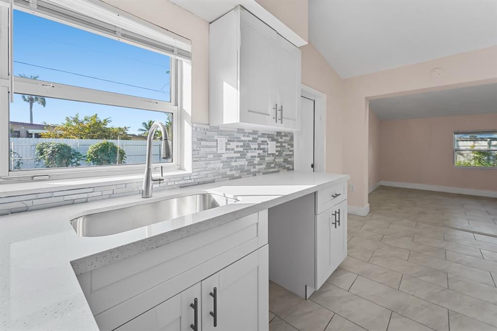 27100 Southwest 144th Avenue Homestead, FL 33032 - Photo 7 of 24 a kitchen with a sink and large window