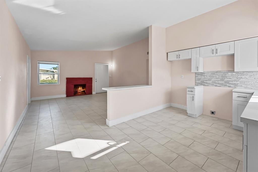 27100 Southwest 144th Avenue Homestead, FL 33032 - Photo 9 of 24 a view of livingroom with furniture and fireplace
