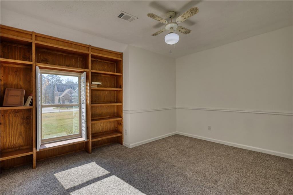 5113 Brownlee Road Southwest Lilburn, GA 30047 - Photo 16 of 48 an empty room with a empty space