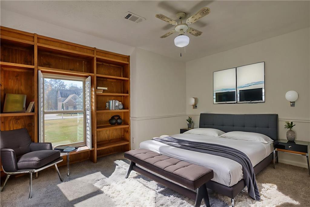 5113 Brownlee Road Southwest Lilburn, GA 30047 - Photo 17 of 48 a bedroom with a bed and a window