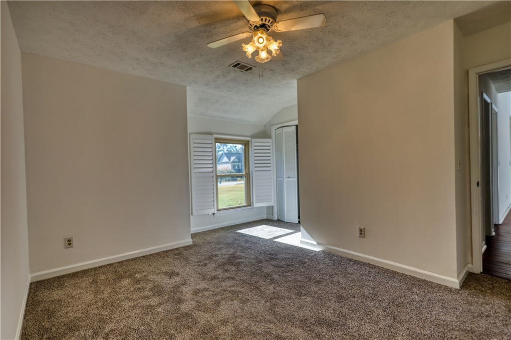 5113 Brownlee Road Southwest Lilburn, GA 30047 - Photo 21 of 48 a view of an empty room with a window