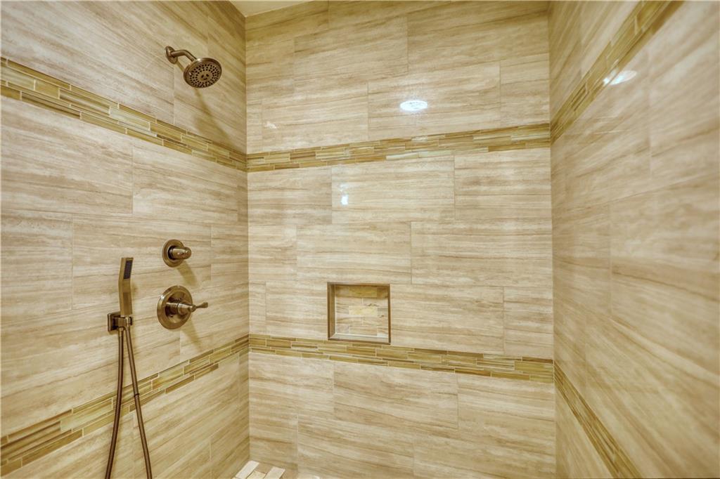 5113 Brownlee Road Southwest Lilburn, GA 30047 - Photo 26 of 48 a bathroom with a shower