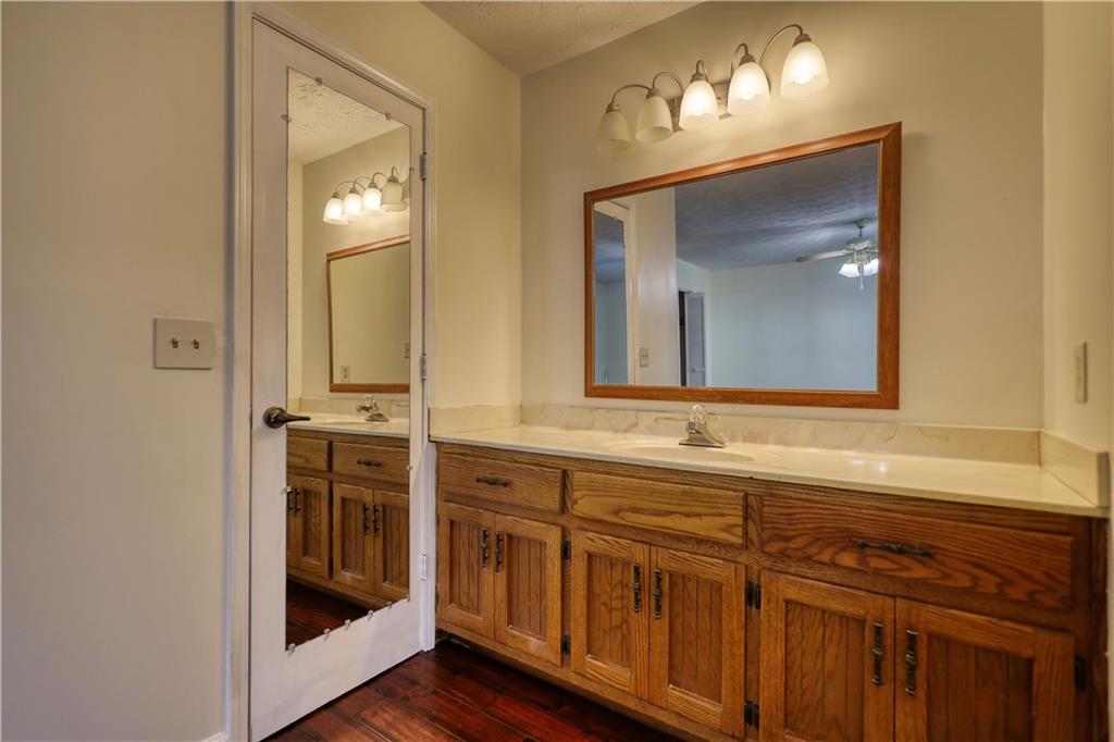 5113 Brownlee Road Southwest Lilburn, GA 30047 - Photo 28 of 48 a bathroom with a sink and a mirror