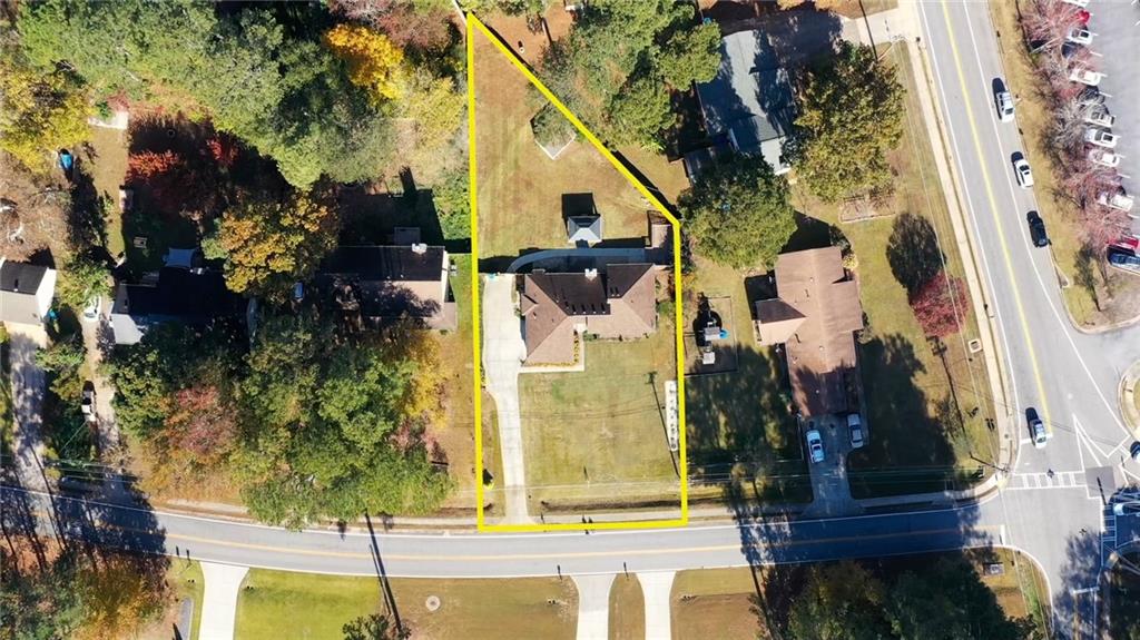 5113 Brownlee Road Southwest Lilburn, GA 30047 - Photo 43 of 48 an aerial view of residential house with outdoor space and trees