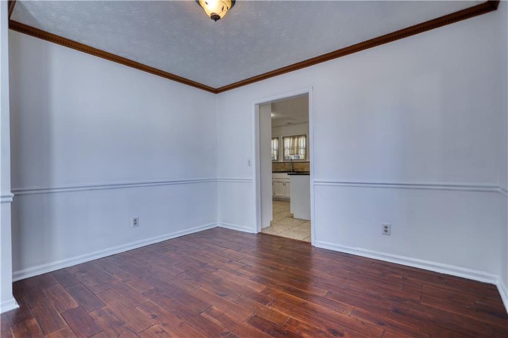 5113 Brownlee Road Southwest Lilburn, GA 30047 - Photo 9 of 48 a view of a room with wooden floor